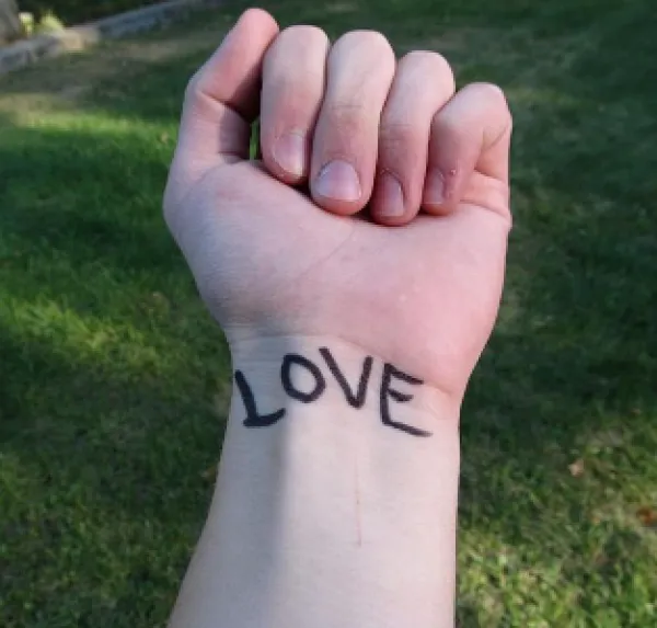 Love tattooed on a wrist