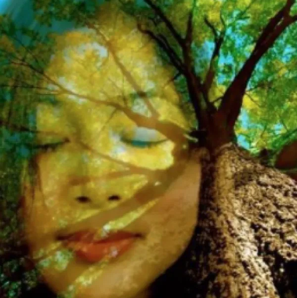 Artistic photo of woman and tree