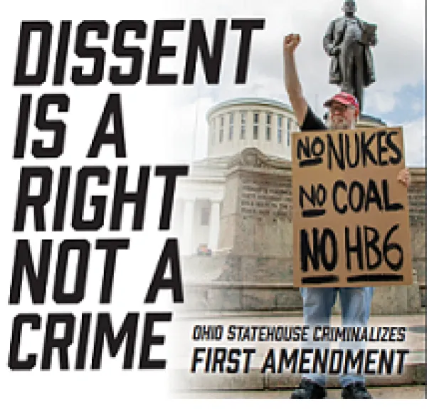 Words Dissent is a right not a crime Ohio Statehouse criminalizes First Amendment and a guy protesting outside the Statehouse 