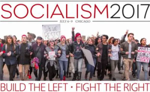 Lots of young people marching and with signs saying RESIST