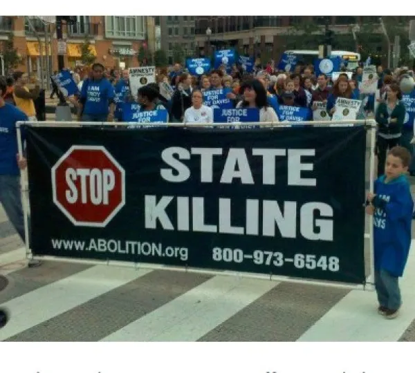 People marching with sign Stop State Killing