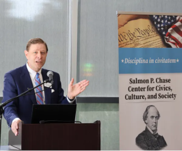 Man speaking at a mic