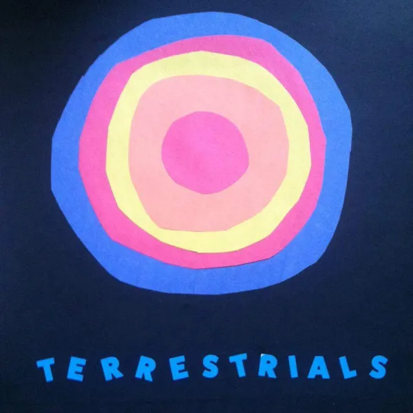 Concentric circles of blue, red, yellow and orange like a sun in the middle of a darker blue background and the word Terrestrials