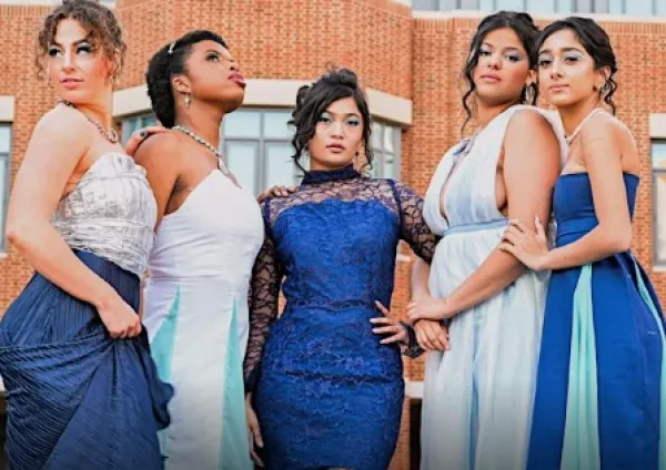 Women posing in gowns