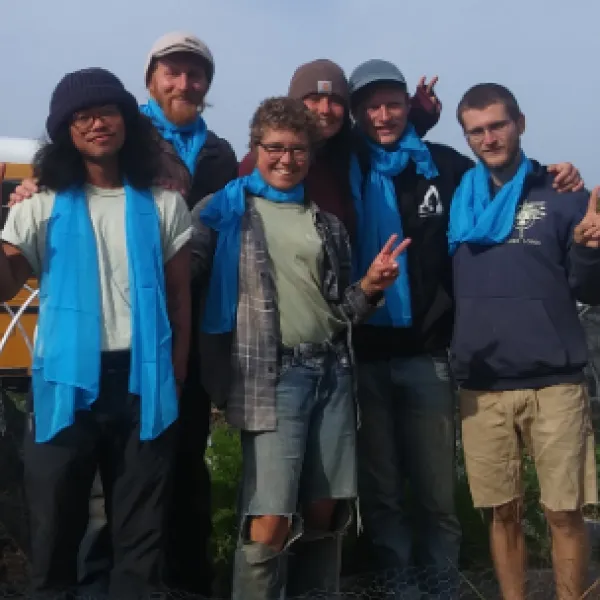 People posing with anti-war T-shirts
