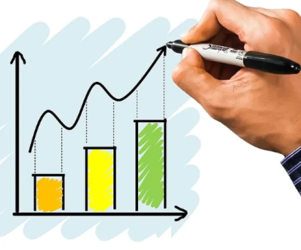 A hand drawing a chart