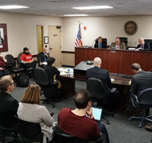 People in what looks like a courtroom
