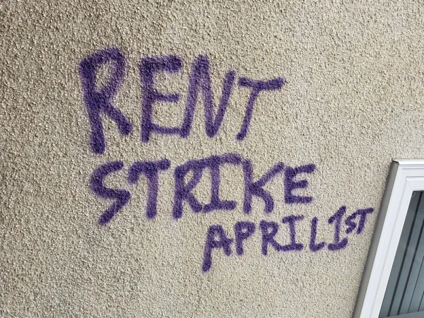 Words Rent Strike April 1st scrawled on a wall