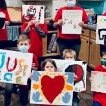 Kids holding signs