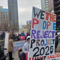 Sign saying We the People reject Project 2025
