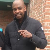 Black man pointing to the left