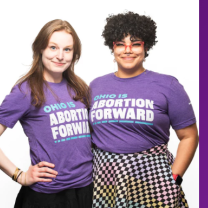 Two women in Abortion Forward shirts