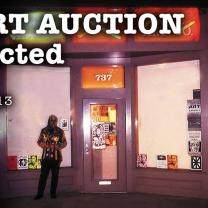 word Auction in front of a building with number 717 and guy dressed up in goblinhood costume