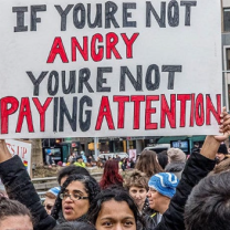 Sign saying If you're not angry, you're not paying attention