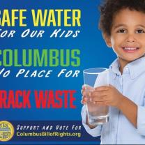 Young black child holding a glass of water and the words Safe Water 