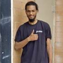 Young man giving a thumbs up sign