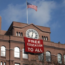 College building with sign Free Education to all