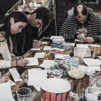 People writing letters