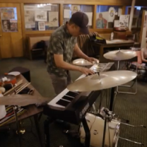 Man playing keyboards and drums