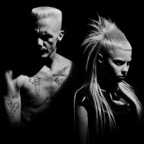 B/W photo of man and woman from band