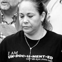 Black and white photo of latina woman with her eyes closed