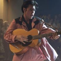 Elvis playing guitar and singing