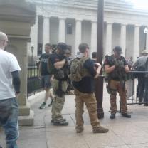 Guy with semi automatic guns at statehouse