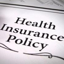 Words Health Insurance Policy with a squiggly line below