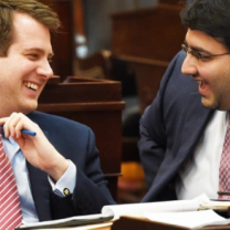 Two white men laughing