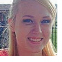 Young white woman with long striaght blonde hair smiling