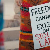 Sign saying Freedom Can't Exist on Stolen Land