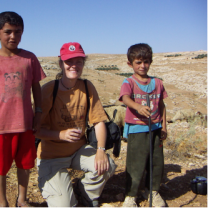 Mary Yoder with two Palestinian children