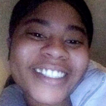 Close up of young black woman smiling