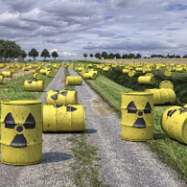 Barrels with radioactive symbols on the ground