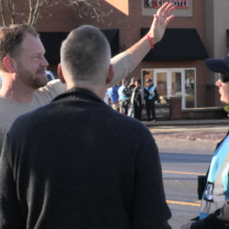 Men talking with police on the street
