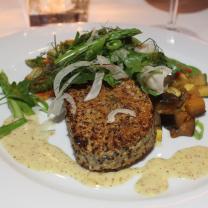 Quinoa and potato cake with fennel salad and roasted vegetables.
