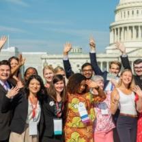 People posing outside capitol building