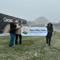 People holding Save Ohio Parks banner