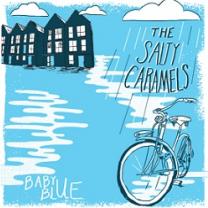 Light blue colored background black and white cartoony houses at top left and clouds and the words the Salty Caramels over a bike and white puddles and the words in white Baby Blue