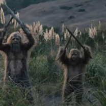 Three Sasquatches holding sticks in the air