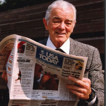 Older man reading the USA Today