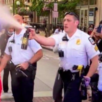 Police spraying pepper spray