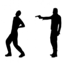 Silhouette of a man shooting another man