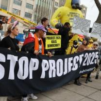 Protestors with Stop Project 2025 banner