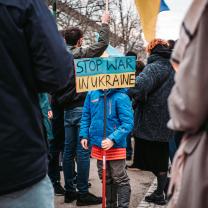 Child with sign Stop War in Ukraine