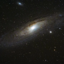 Stars against a black sky with an oblong bit of whiteness like the Milky Way