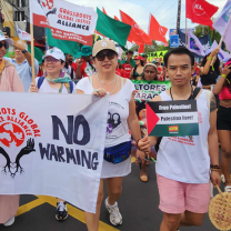 People marching and holding a banner