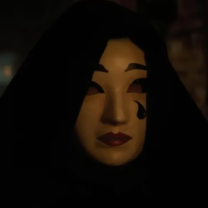 Face with white makeup and a tear on the cheek