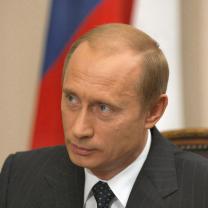 Putin's face, white guy with balding brown hair and a suit