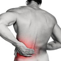 Naked man's back with red glow at the bottom and him holding it as if in pain